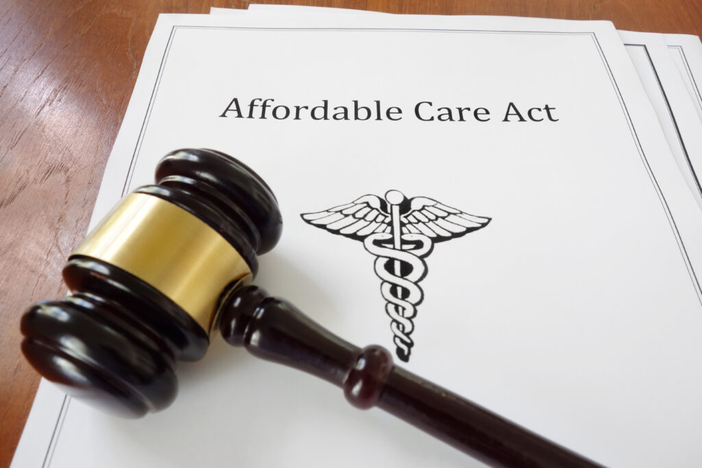 Papers labeled "Affordable Care Act" underneath a gavel.